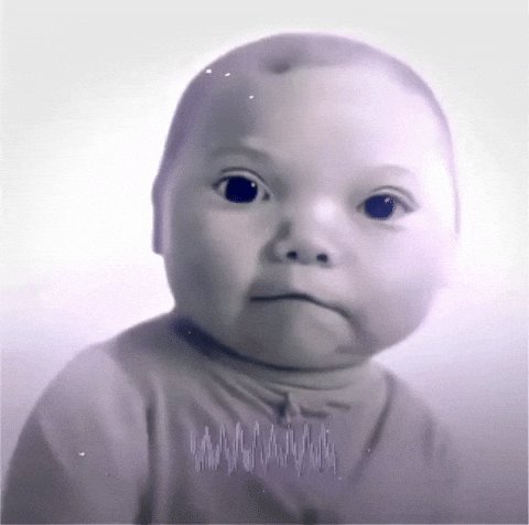 Reaction GIF (still frame): a baby giving a slow, suspicious stare.